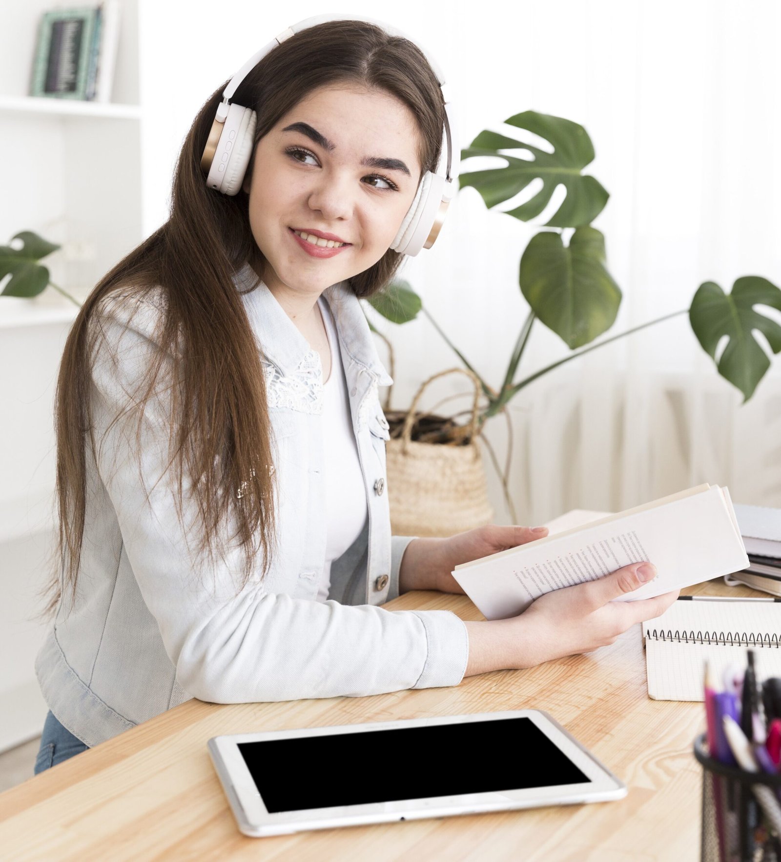 teenager listening music while studying